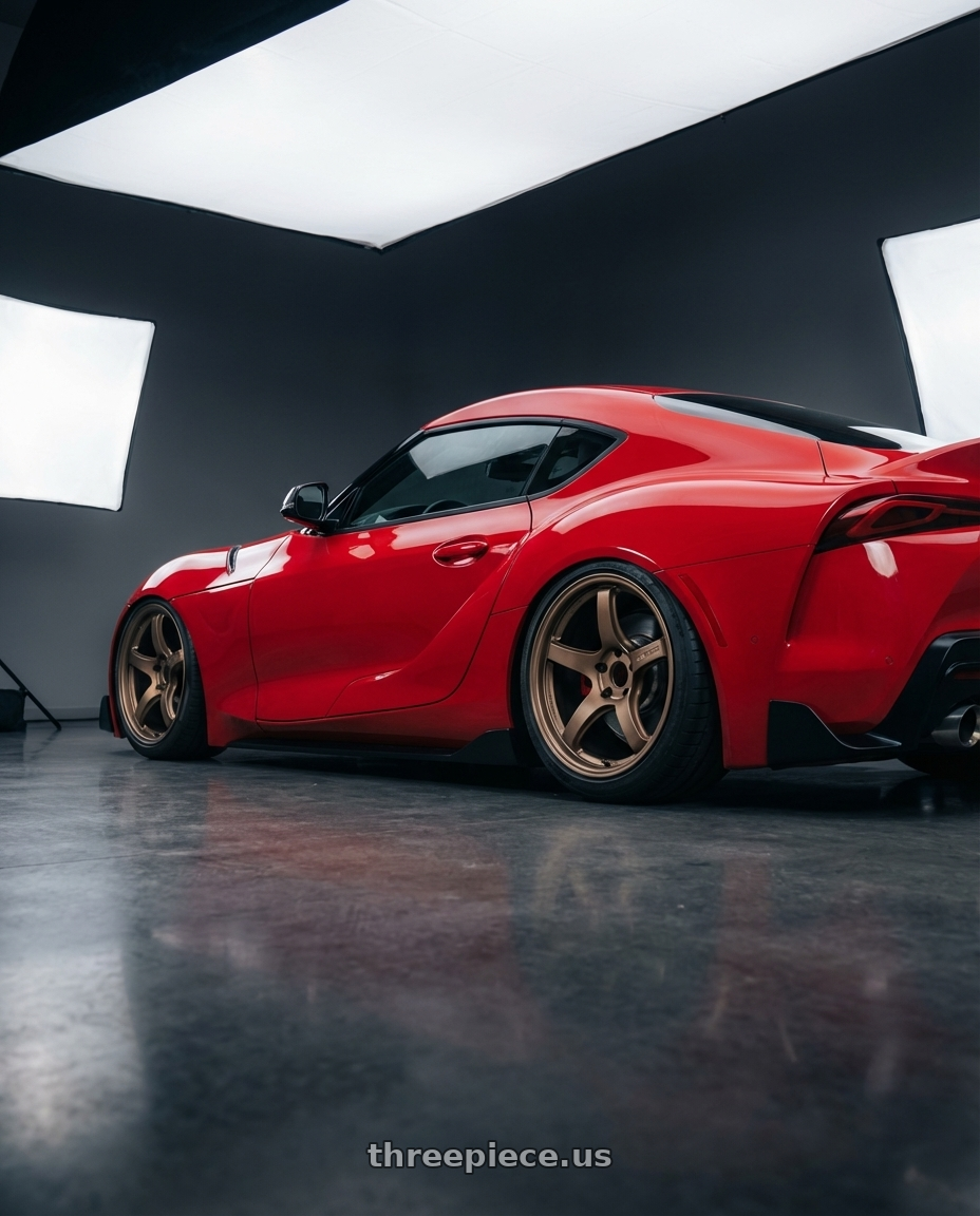 2023 Toyota GR Supra with Gram Lights 57CR 5x112 19x9.5+25 Bronze II wheels rear three quarter view slight stretch tires