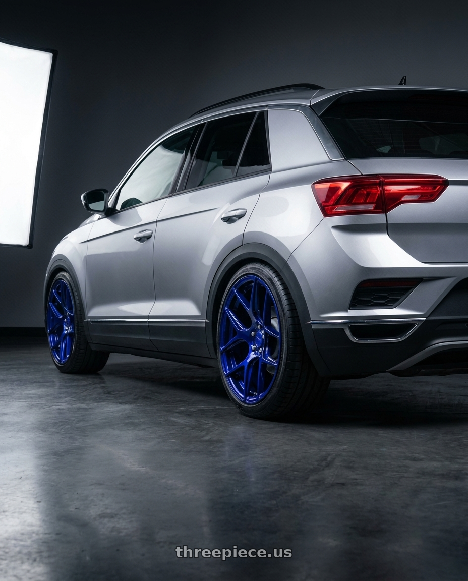 2023 T Roc 330 with MRR FS1 5x130 18x8.5  +45 Candy Blue wheels rear three quarter view square tires