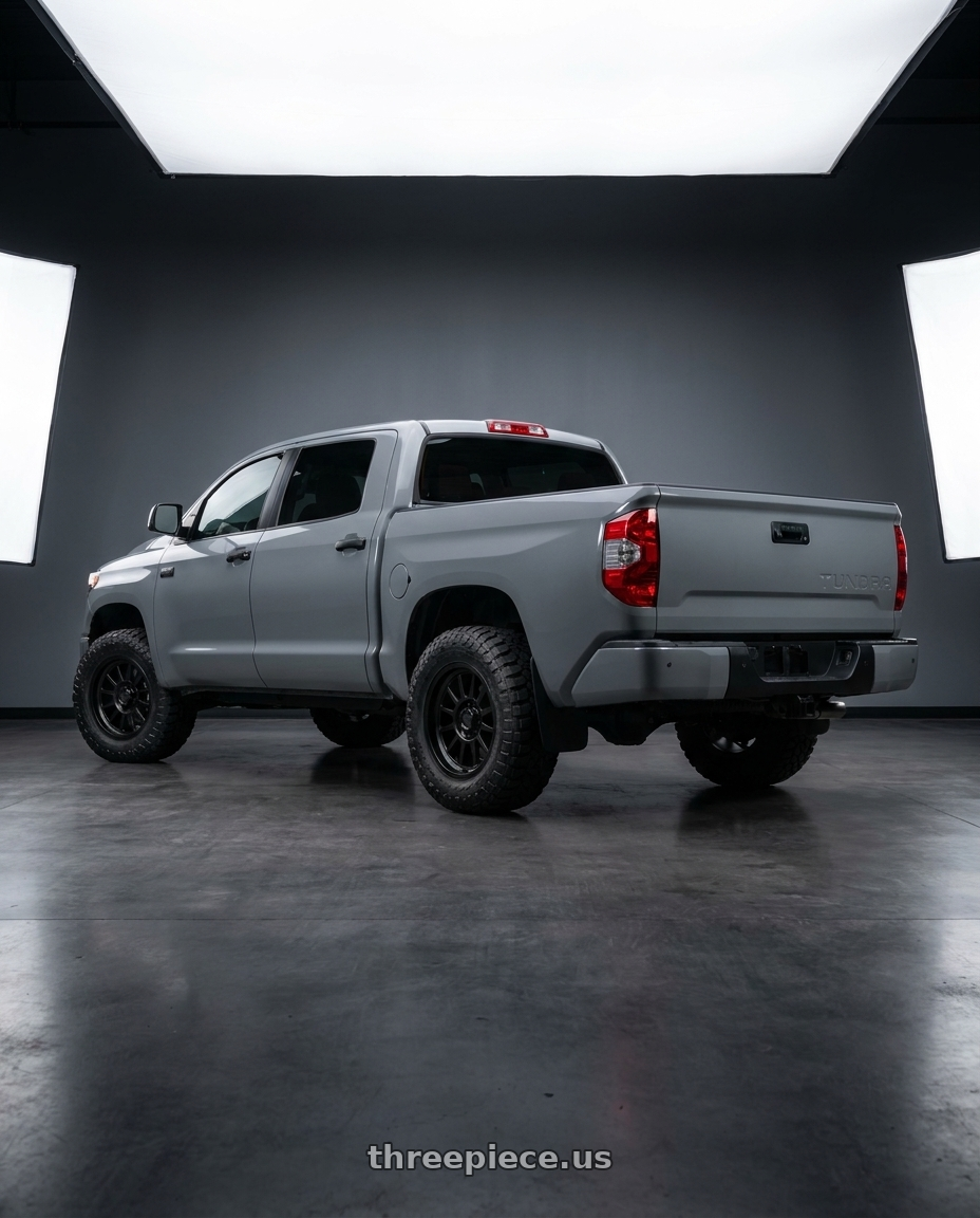 2018 Toyota Tundra with KMC KM101 TEMPO 5X150 20X9 +18 SATIN BLACK wheels rear three quarter view meaty tires