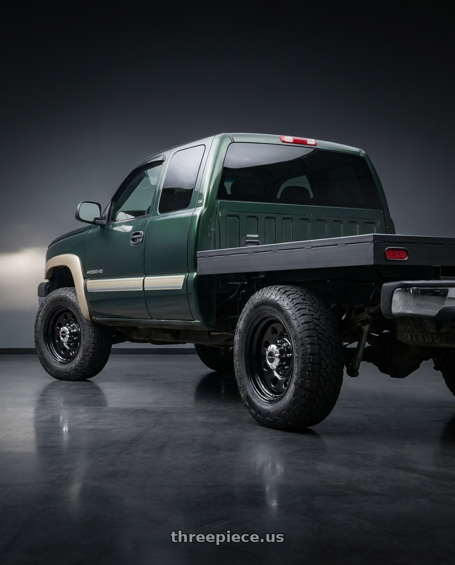 2003 Chevy Silverado 2500 HD with Vision HD 85H 8x165.1 17x9-12 Gloss Black wheels rear three quarter view meaty tires