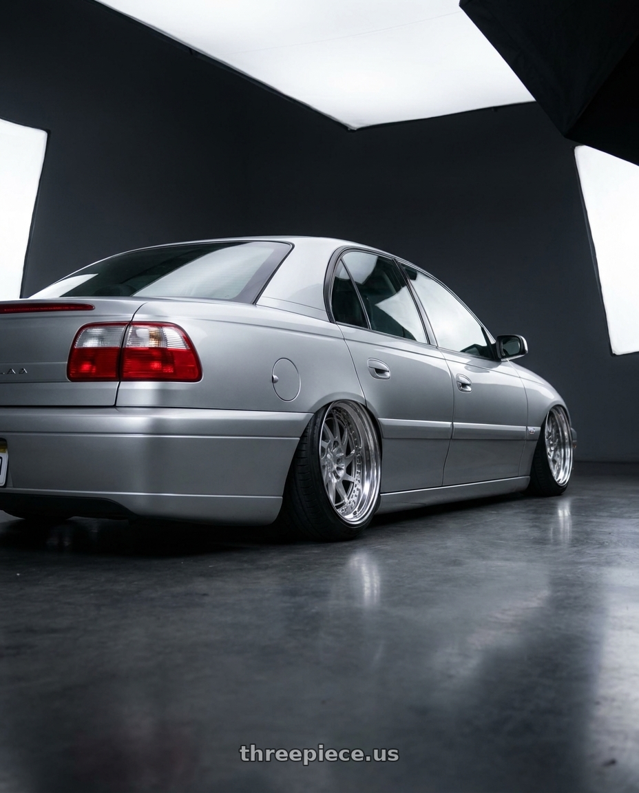 2002 Cadillac Catera with Heritage Wheel HOKKAIDO-DIR wheels rear three quarter view slight stretch tires