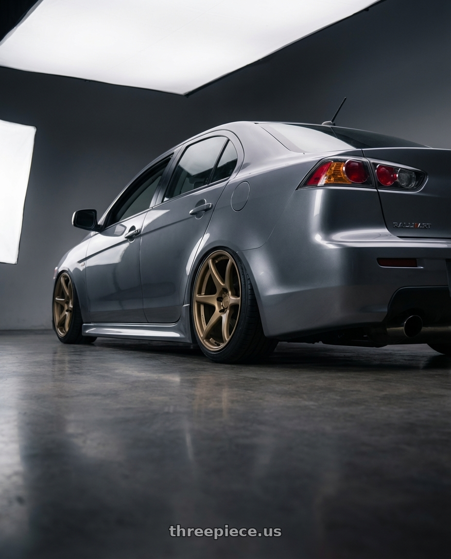 2014 Mitsubishi Lancer Ralliart with Kansei K11B Tandem 5x114.3 18x10.5 12 Bronze wheels rear three quarter view slight stretch tires