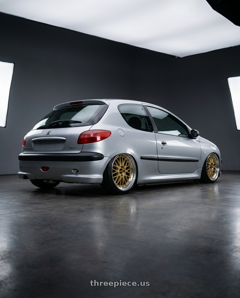 2005 Peugeot 206 with BBS LM 5x114.3 18x9.0+42 Gold wheels rear three quarter view slight stretch tires
