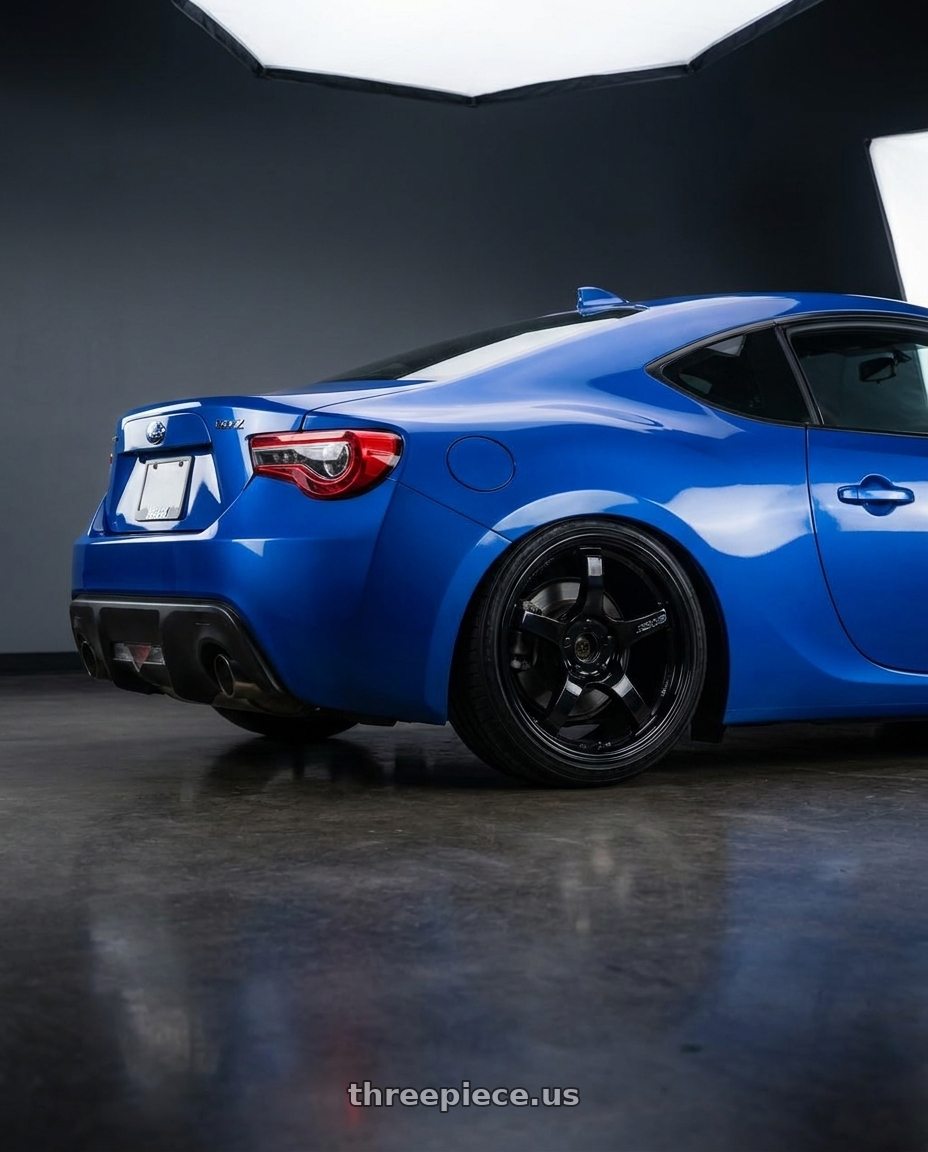 2017 Subaru BRZ with Gram Lights 57CR 5x100 18x9.5+38 Glossy Black wheels rear three quarter view slight stretch tires