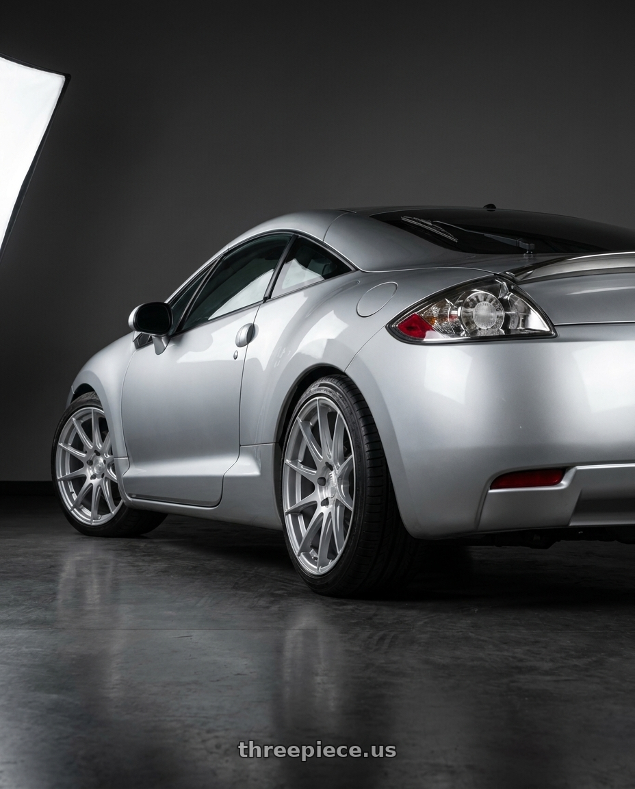 2010 Mitsubishi Eclipse with Aodhan AH09 5x114.3 18x8.5 +35 Gloss Silver Machined Face wheels rear three quarter view square tires