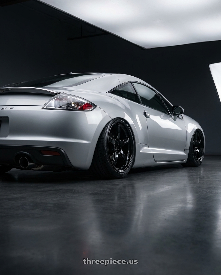 2010 Mitsubishi Eclipse with Gram Lights 57CR 5x114.3 19x8.5+35 Glossy Black wheels rear three quarter view slight stretch tires
