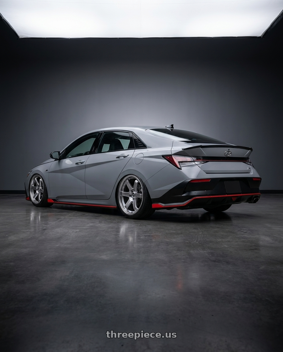 2025 Elantra n line with F1R F106 5x114.3 17x8 +35 Hyper Black wheels rear three quarter view slight stretch tires