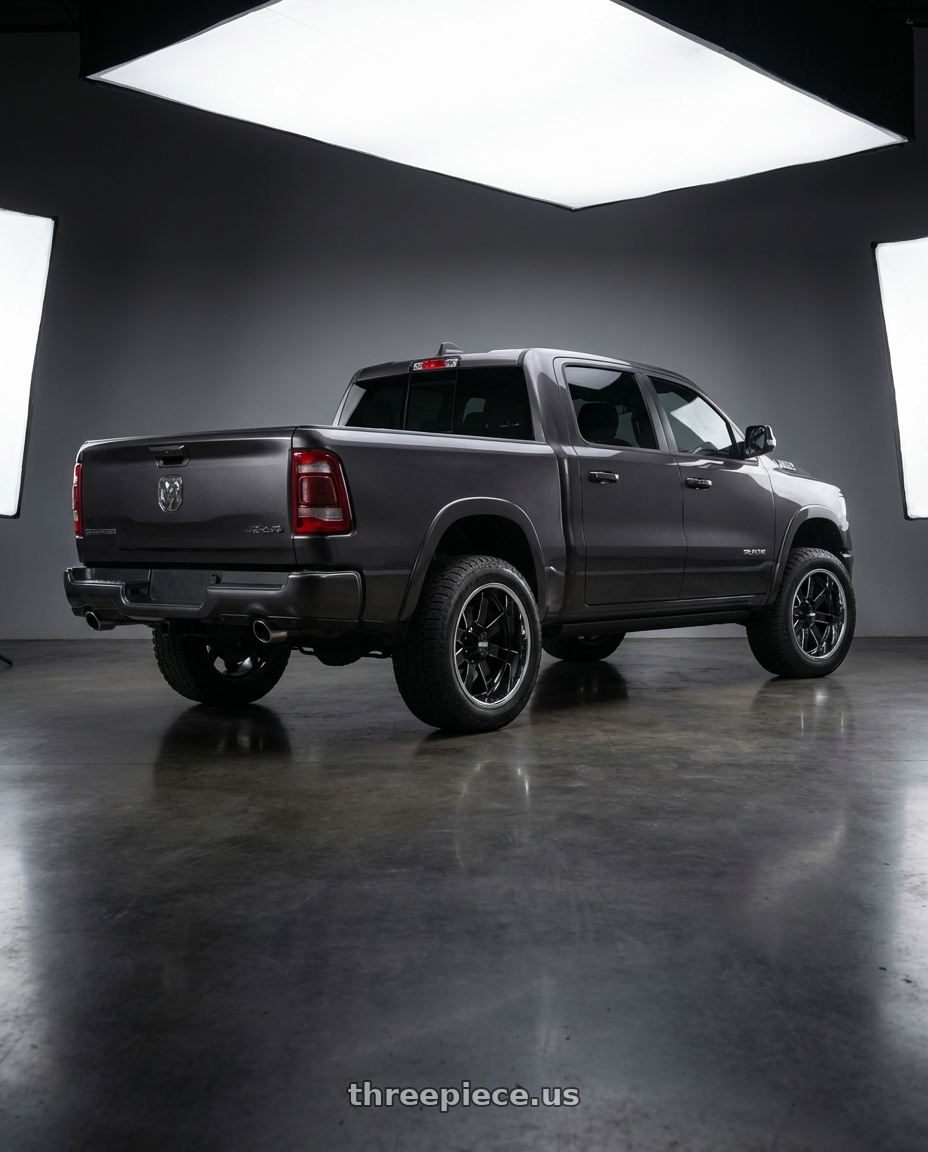 2024 Ram 1500 with Moto Metal MO200 6X139.7 22X10 -18 GLOSS BLACK MILLED CENTER CHROME LIP wheels rear three quarter view meaty tires