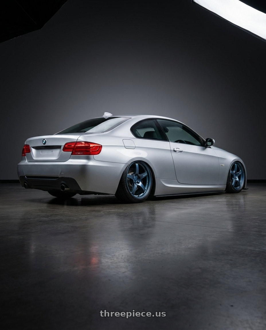 2012 BMW 3 Series E92 with Gram Lights 57CR 5x120 19x10.5+22 Gunblue II wheels rear three quarter view slight stretch tires