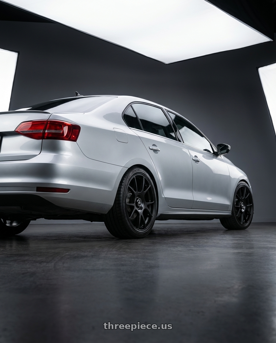 2016 Volkswagen Jetta GLI MK6 with fifteen52 COMP 5x112 / 5x120 18x8.5 +35 ASPHALT BLACK (SATIN BLACK) wheels rear three quarter view square tires