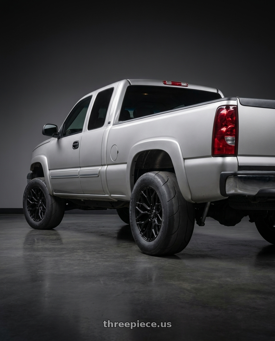 2007 Chevy Silverado with DOLCE PERFORMANCE PISTA 5x114.3 18x8.5 +35 Gloss Black wheels rear three quarter view excessive tires