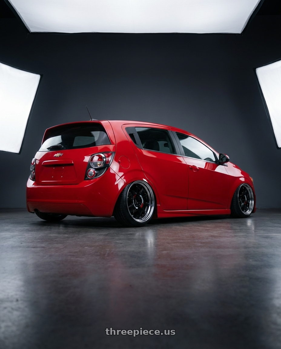 2014 Chevy Sonic with Work Emotion Rs11 2p 4x100 17x6 0 black wheels rear three quarter view slight stretch tires
