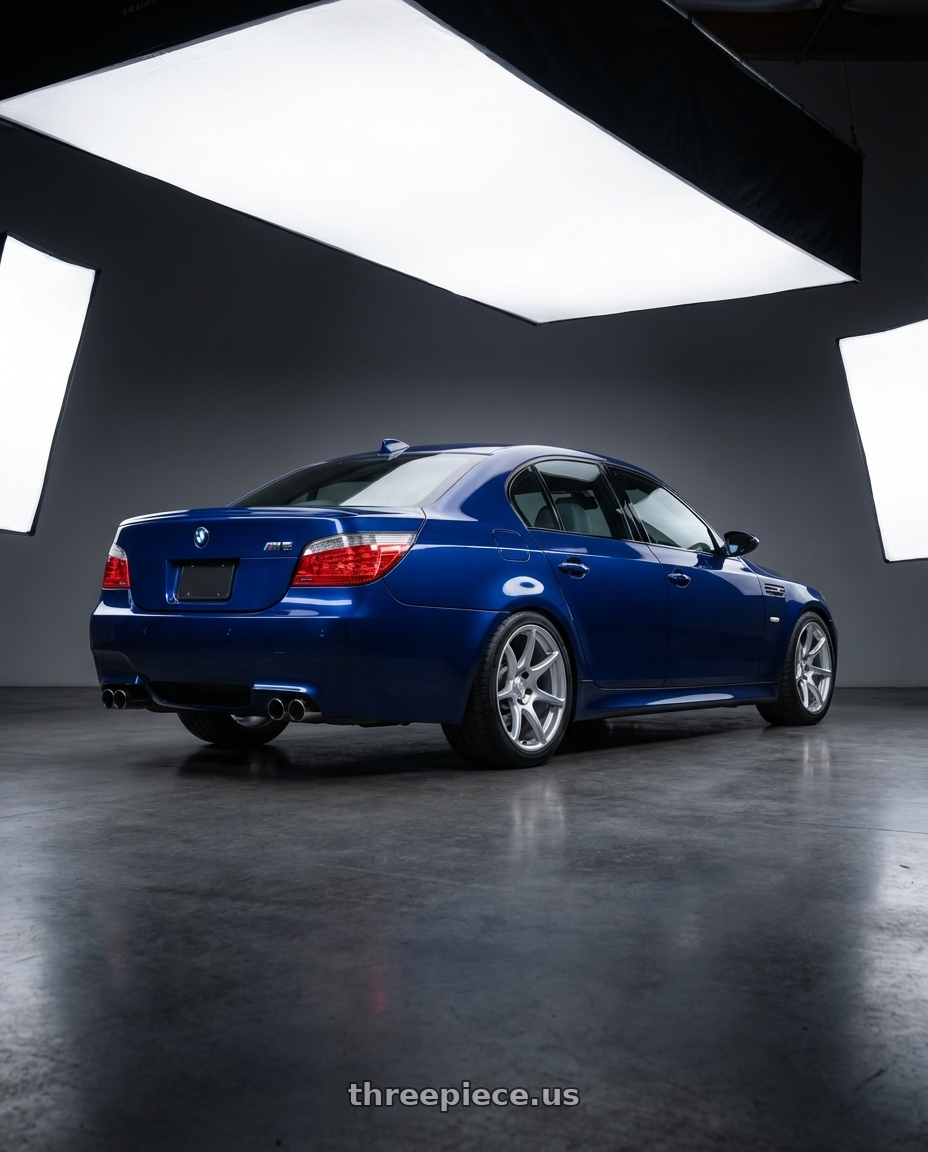 2010 BMW M5 E60 with Kansei K11S Tandem 5X120 19x10.5 22 Hyper Silver wheels rear three quarter view square tires