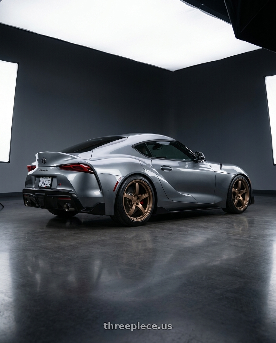2021 GR Supra, 3.0 Premium with Gram Lights 57CR 5x100 18x9.5+38 Bronze II wheels rear three quarter view square tires