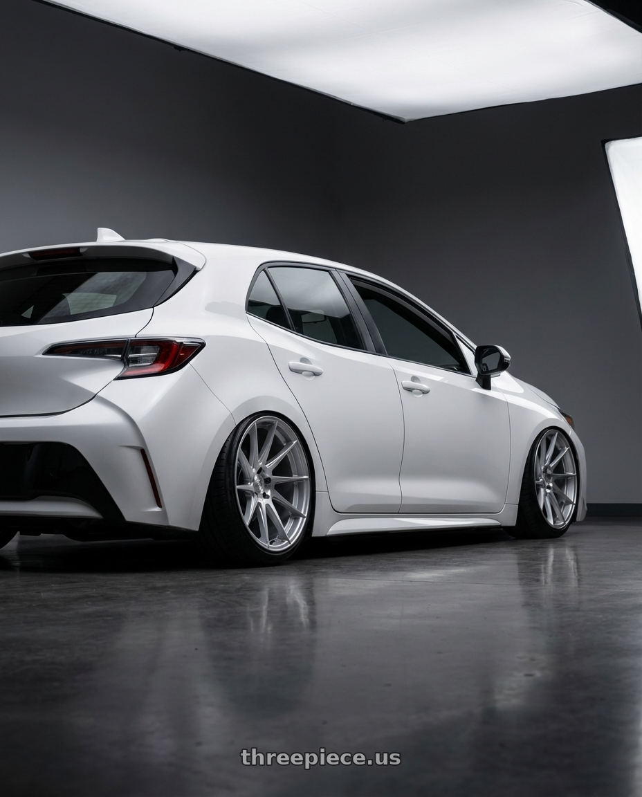 2023 Toyota Corolla Hatchback with Aodhan AH09 5x114.3 18x9.5 +35 Gloss Silver Machined Face wheels rear three quarter view slight stretch tires