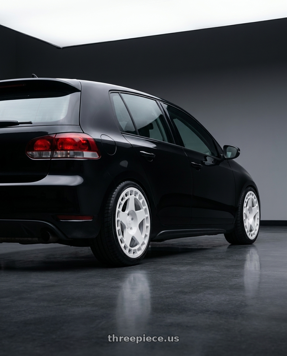 2012 Golf TDI with fifteen52 TURBOMAC 5x114.3 18x8.5 +30 RALLY WHITE (GLOSS WHITE) wheels rear three quarter view square tires