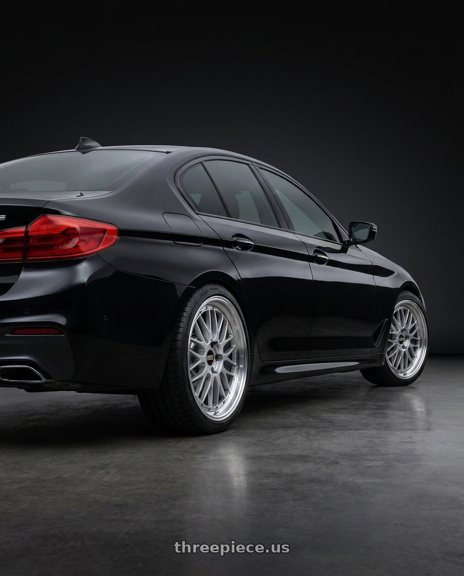 2018 BMW 5 with BBS LM 5x114.3 20x10.0+38 Diamond Silver wheels rear three quarter view square tires
