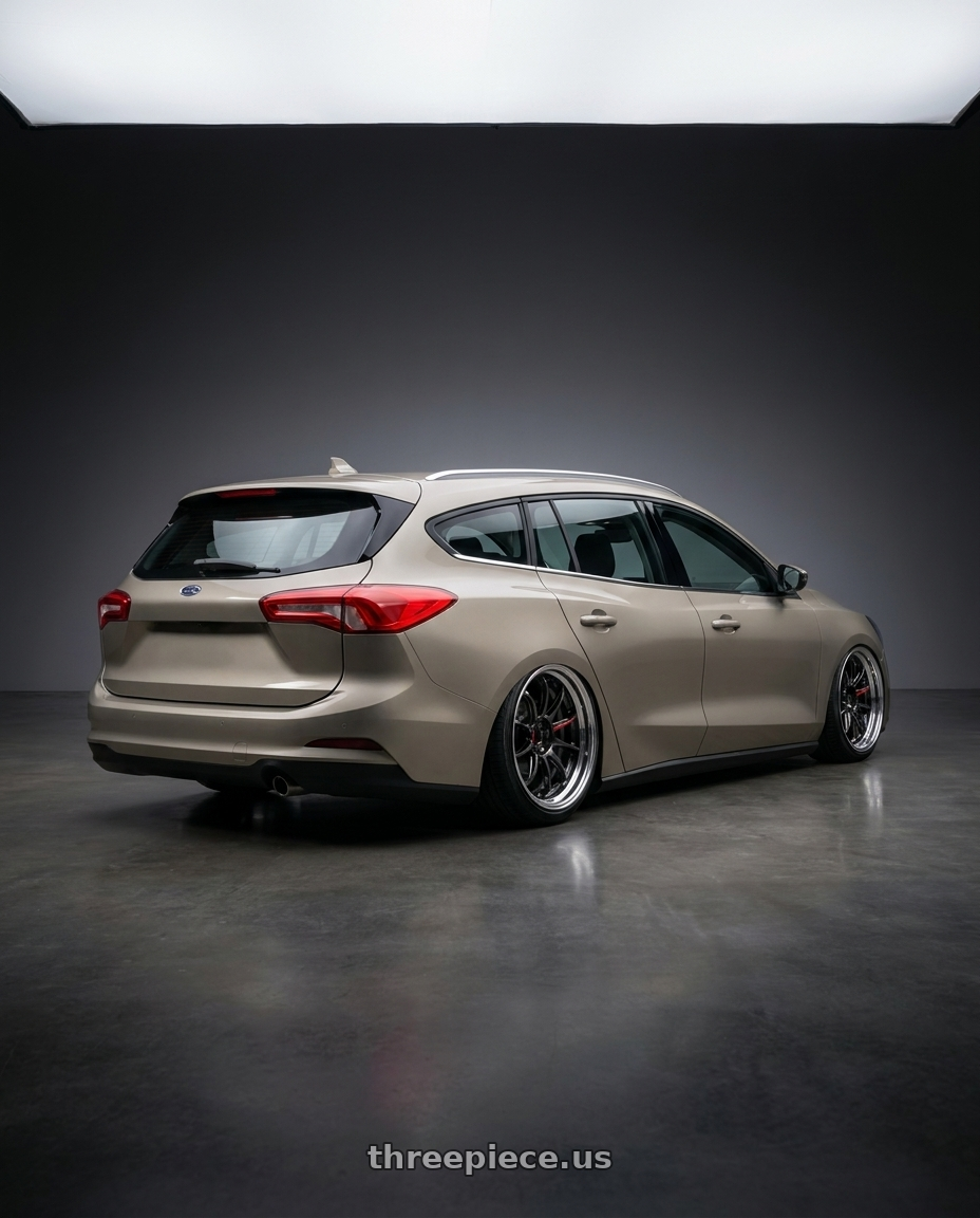 2025 Focus wagon with Work Zr10 2P 5x108 18x10.0 +12 Glim Black wheels rear three quarter view slight stretch tires