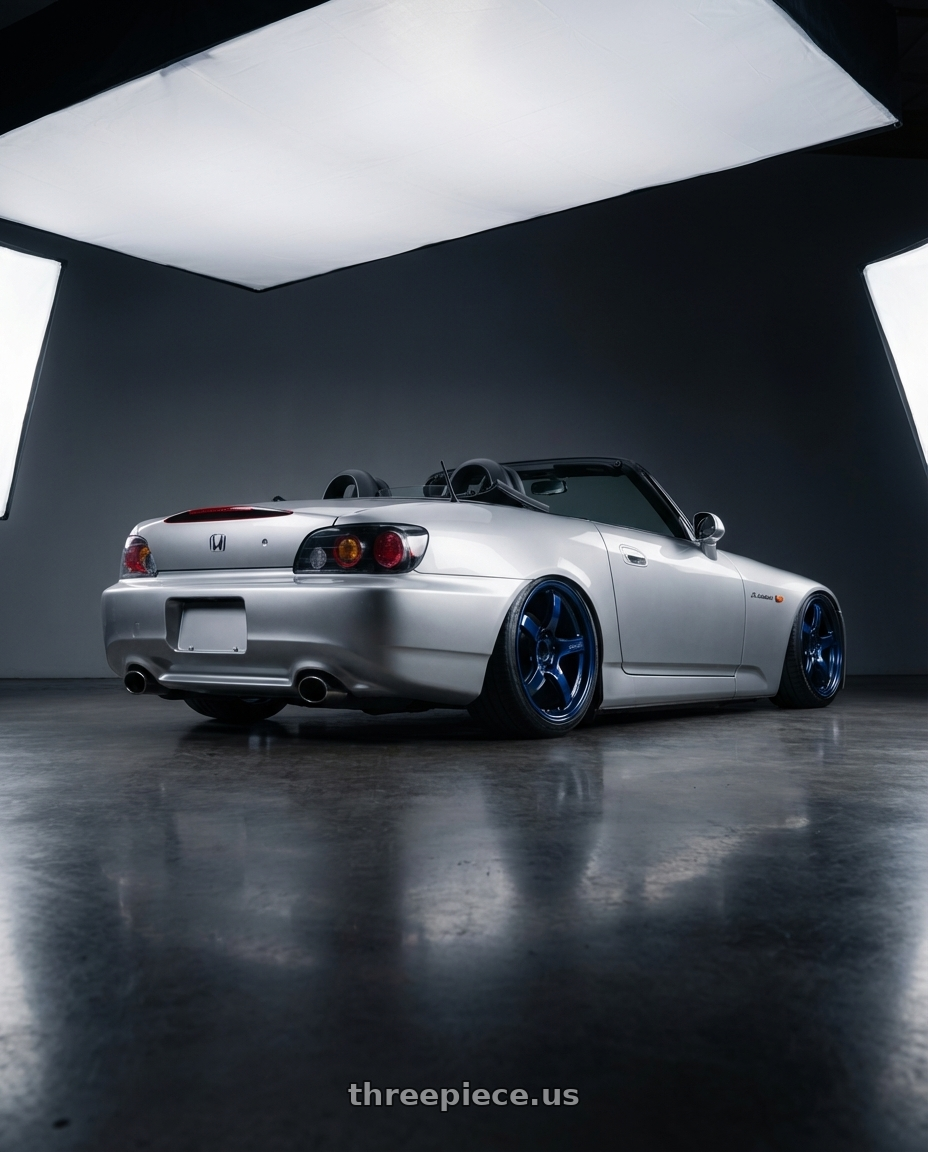 2009 Honda S2000 with Gram Lights 57CR 5x114.3 18x9.5+22 Eternal Blue Pearl wheels rear three quarter view slight stretch tires