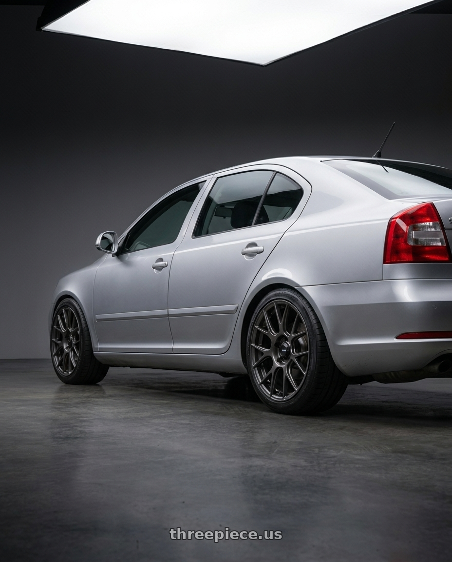 2012 Skoda Octavia with Konig Ampliform 5x112 18x8.5+43 Dark Metallic Graphite wheels rear three quarter view square tires