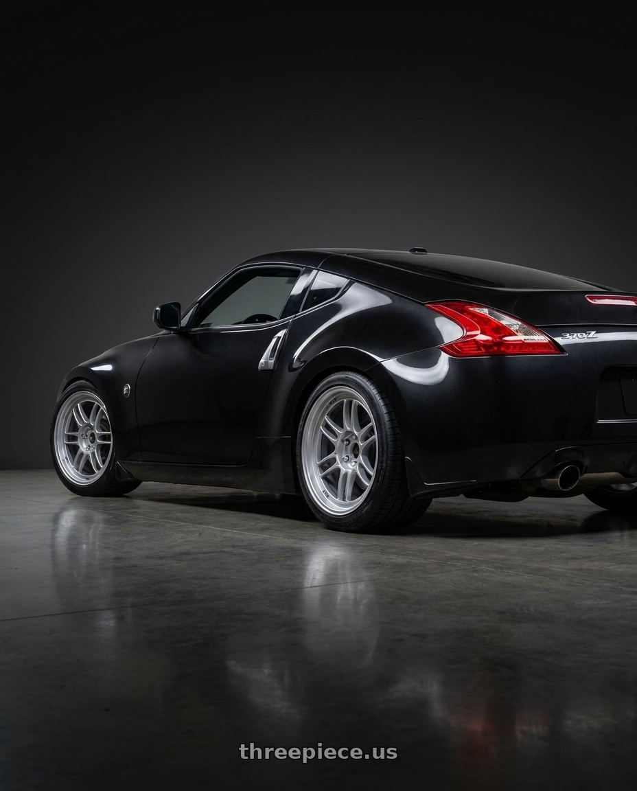 2009 Nissan 370z Magnetic Back Metallic with Enkei RPF1 5x114.3 18x10.5+15 Silver wheels rear three quarter view square tires