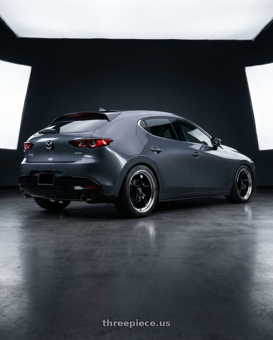 2023 Mazda Mazda3 Turbo with Forgestar D5 Drag 5x114.3 18x10 +42 Gloss Black Machined wheels rear three quarter view square tires