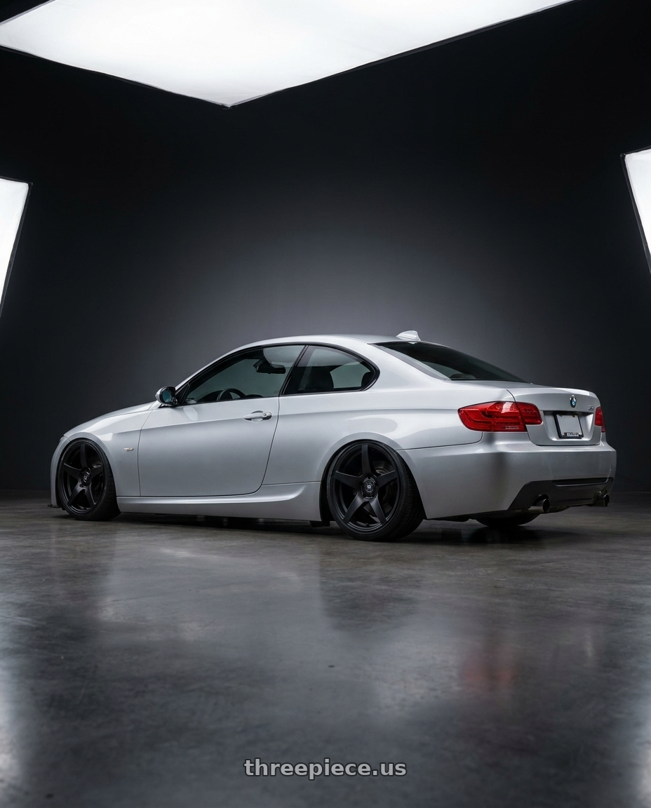 2012 BMW 3 Series E92 with Forgestar CF5V 5x120 19x9 +38 Satin Black wheels rear three quarter view slight stretch tires