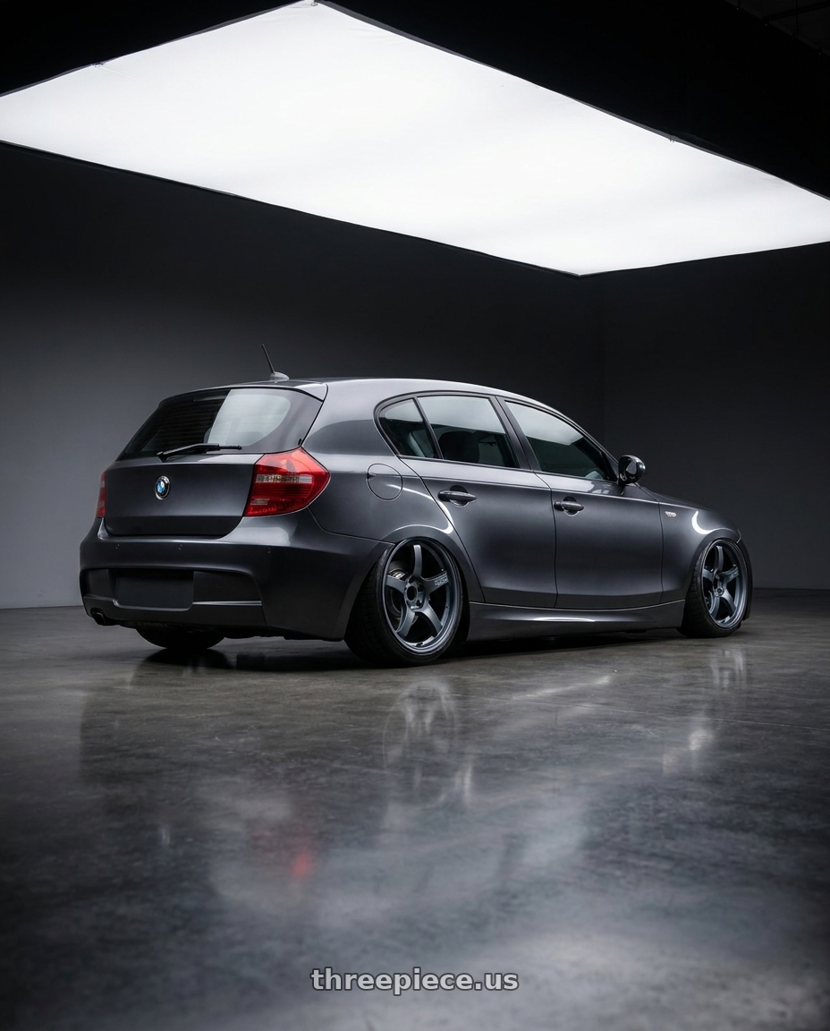 2012 BMW 1 Series E82 with Gram Lights 57CR 5x120 19x9.5+25 Gunblue II wheels rear three quarter view slight stretch tires