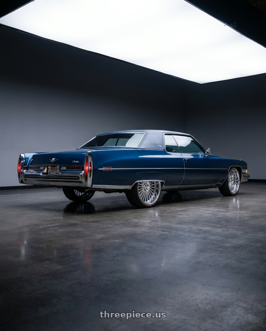 1973 Cadillac Devile with Amani R.E.A.L. 5x120/5x127 26x9 +1 Brush Center Chrome Lip wheels rear three quarter view extreme stretch tires