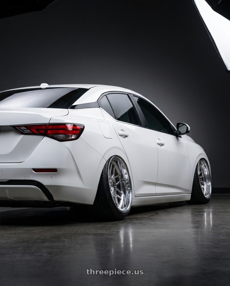 2025 Nissan Sentra  with Axe AF6 Forged 6x135/6x139.7 24X12 -44 FULLY POLISHED wheels rear three quarter view extreme stretch tires