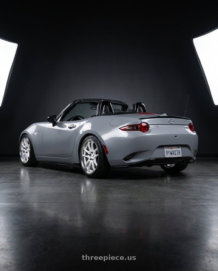 2026 Mazda MX-5 Club with Work Cr 2P 4x100 17x8.0 +38 Gloss White wheels rear three quarter view slight stretch tires