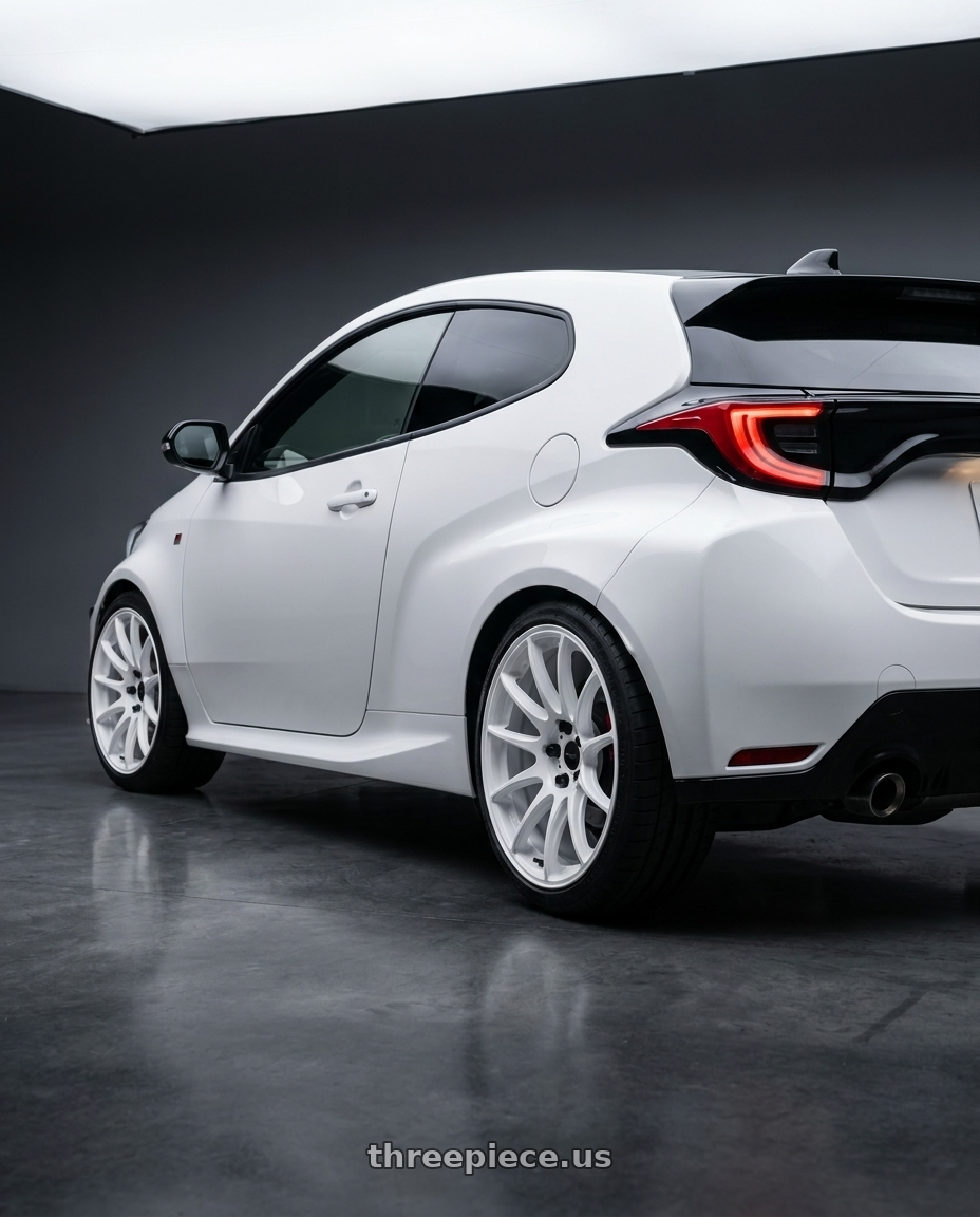 2021 gr yaris with WORK Emotion CR Shigoku 5x114.3 18x9 +38 Ice White ICW wheels rear three quarter view square tires