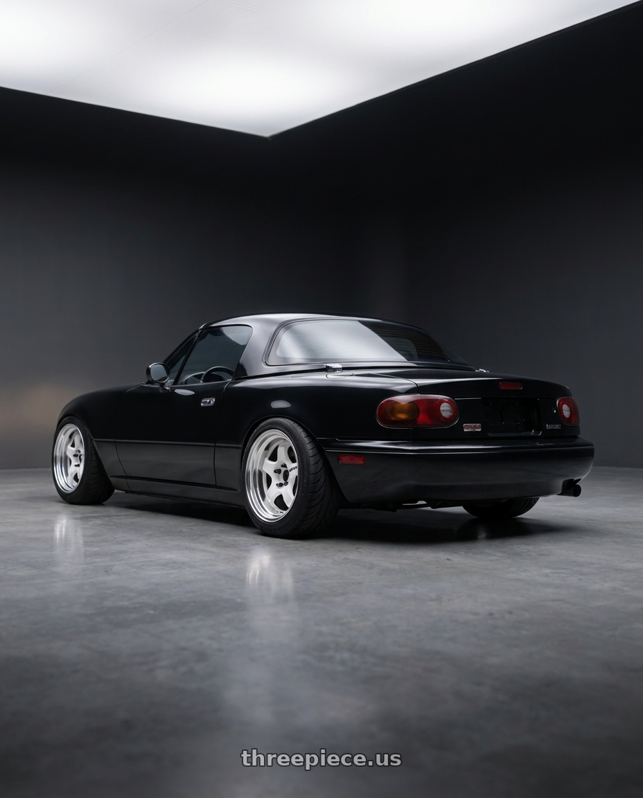 1995 Mazda miata with Work Meister S1 2P 4x100 15x9+12 A Disk Black wheels rear three quarter view meaty tires