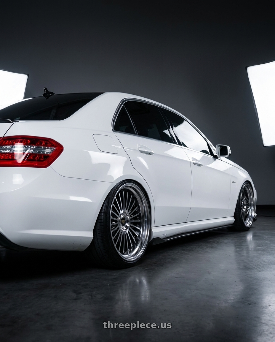 2012 Mercedes E350 sport rwd with Work Emitz Black Polish 5x112 20x10.0 +38 wheels rear three quarter view slight stretch tires