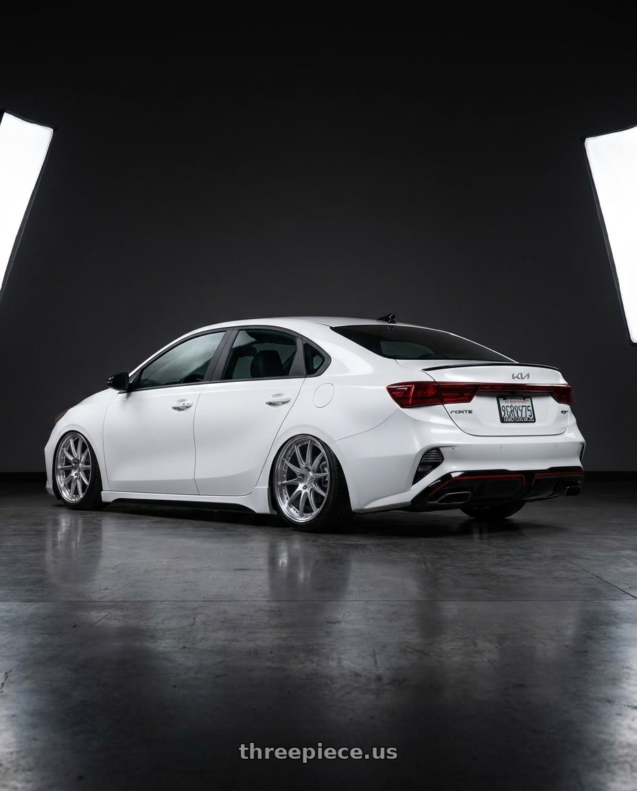 2023 kia forte with Aodhan DS07 5x100 18x9.5+35 Silver w/Machined Face wheels rear three quarter view slight stretch tires