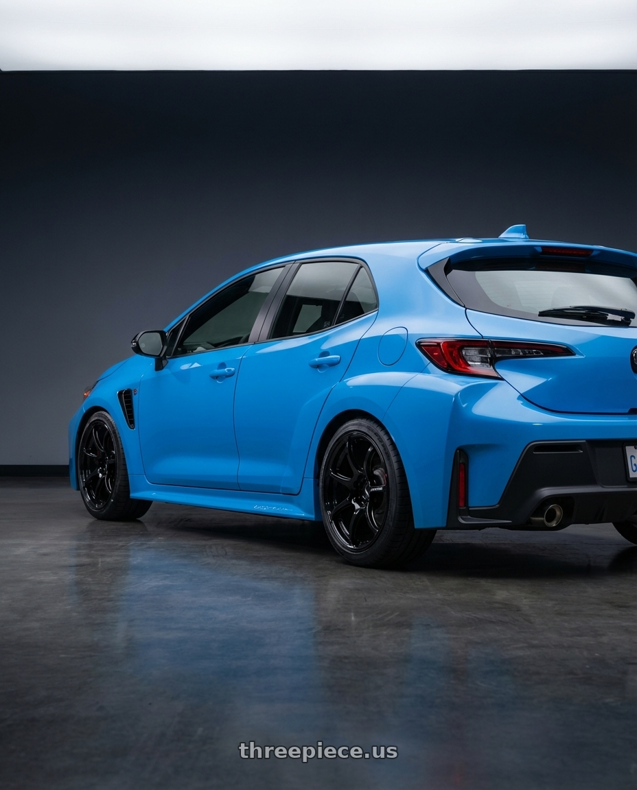 2024 Toyota GR Corolla with Advan RGIII 5x114.3 18x9.0+25 Gloss Black wheels rear three quarter view square tires