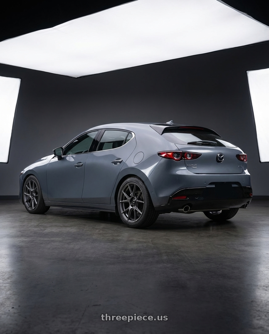 2023 Mazda Mazda3 Turbo with Konig Ampliform 5x114.3 18x10+20 Dark Metallic Graphite wheels rear three quarter view square tires