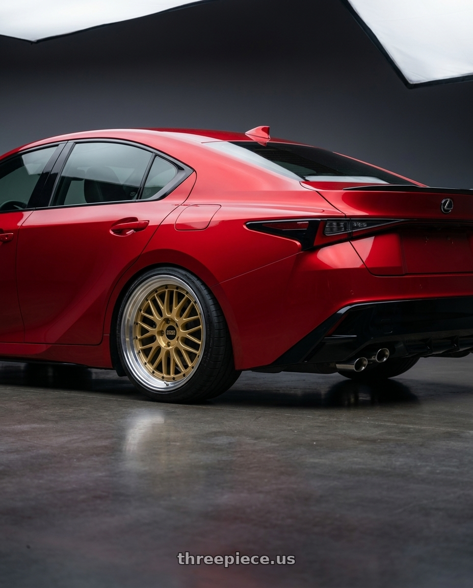 2023 Lexus IS500 with BBS LM 5x114.3 18x9.0+42 Gold wheels rear three quarter view square tires