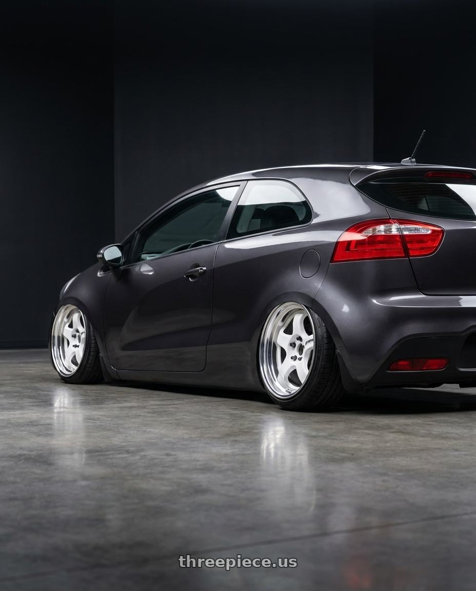 2013 Kia rio 3 with Work Meister S1 2P 4x100 15x10+0 A Disk Black wheels rear three quarter view extreme stretch tires