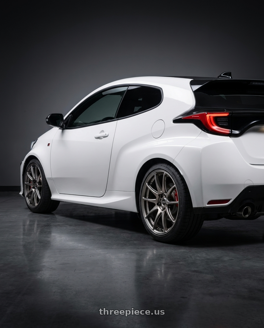 2021 gr yaris with WORK Emotion CR Shigoku 5x114.3 18x8.5 +38 Glow Gunmetal GGM wheels rear three quarter view square tires