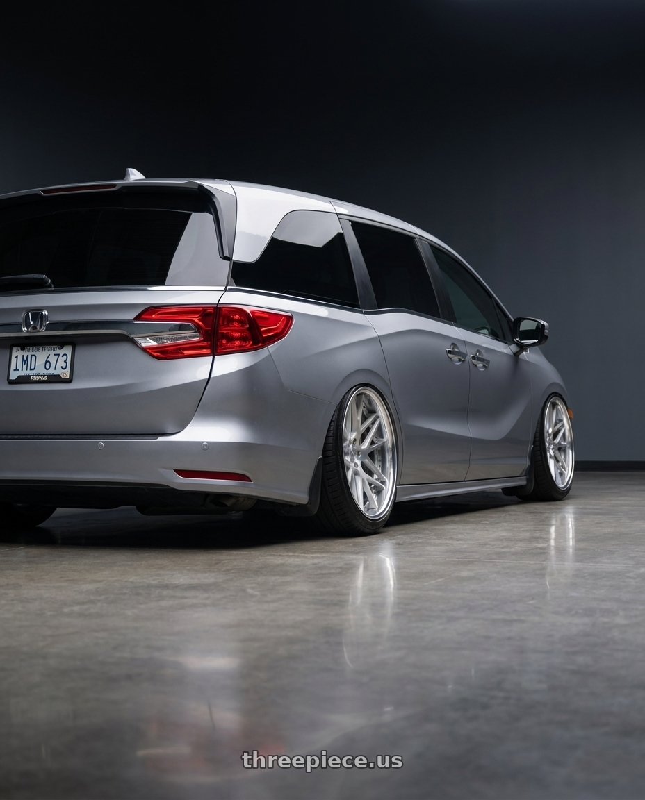 2024 Honda Odyssey with Work Gnosis Cvx 5x120 20x8+38 O Disk Matte Silver wheels rear three quarter view extreme stretch tires