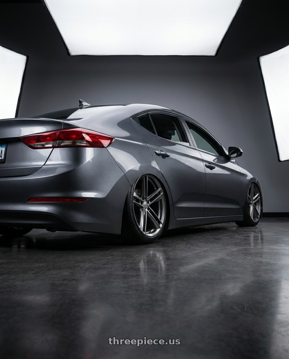 2017 Super elantra with OHM LIGHTNING 5X120 18X8.5 +30 GLOSS GUNMETAL wheels rear three quarter view slight stretch tires