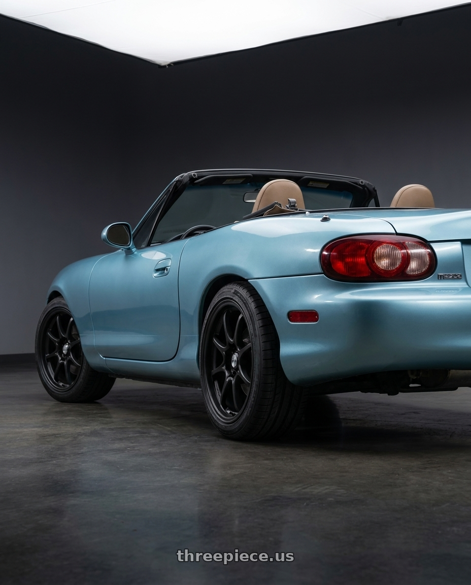 2002 Mazda Miata with Konig 72B Helium 4x100 15x6.5 +40 Matte Black wheels rear three quarter view square tires