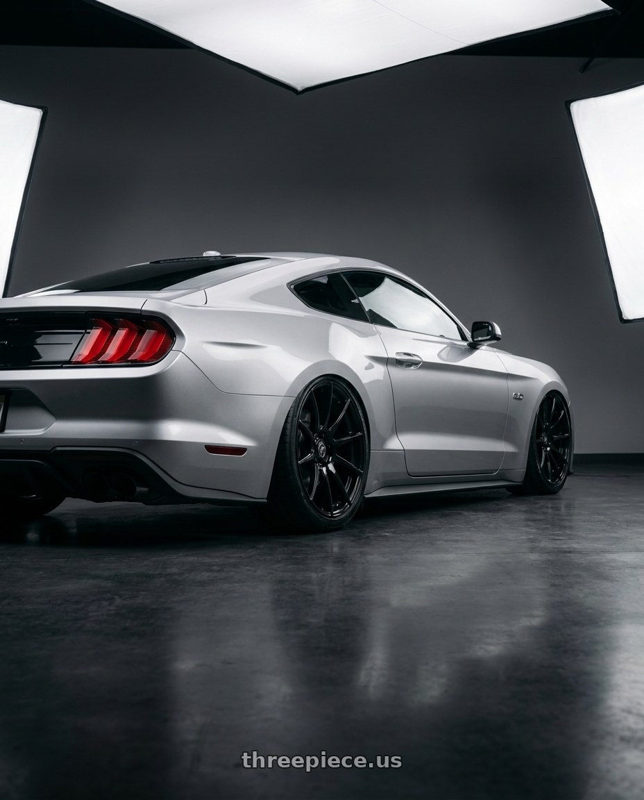 2018 Ford mustang with Forgestar CF10 5x114.3 19x9.5 +29 Gloss Black wheels rear three quarter view slight stretch tires