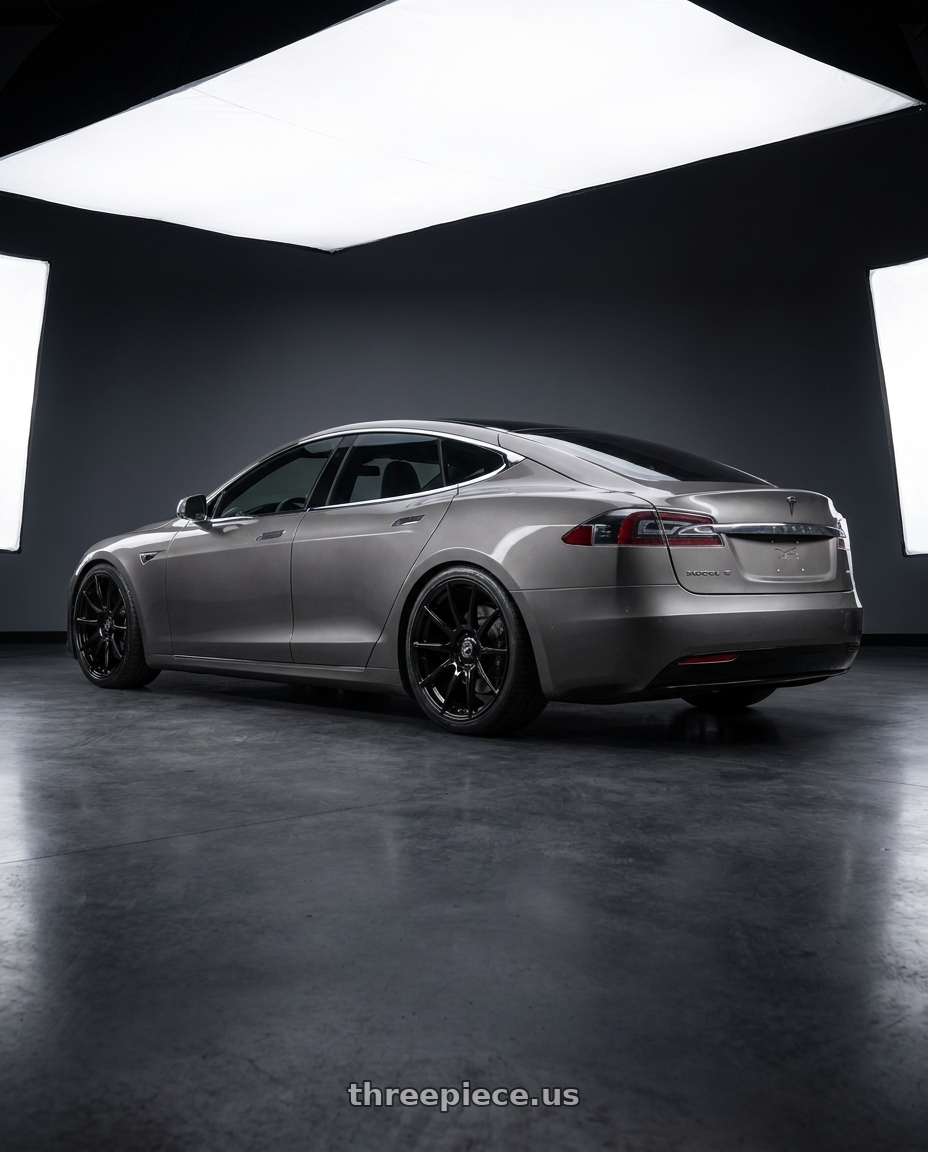 2018 Tesla Model S with Forgestar CF10 5x120 21x12 +52 Gloss Black wheels rear three quarter view square tires