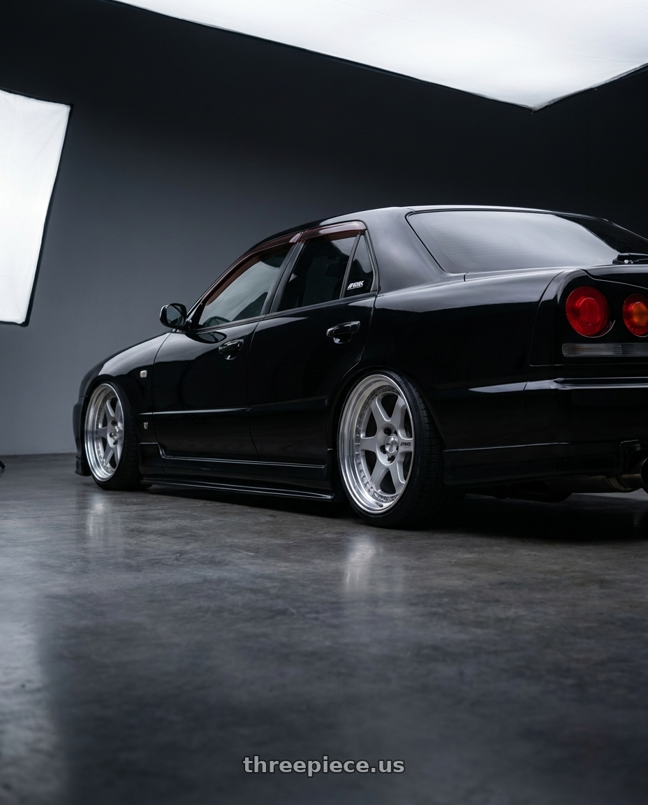 1998 Nissan Skyline R34 25GT 4DR BLACK with Work Meister L1 3P 5x114.3 18x9+14 R Disk Matte Silver wheels rear three quarter view square tires