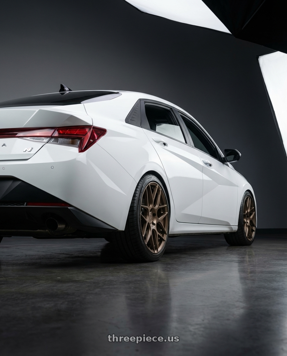 2024 Hyundai Elantra N with Aodhan AFF2 5x114.3 19x8.5+35 Matte Bronze wheels rear three quarter view square tires