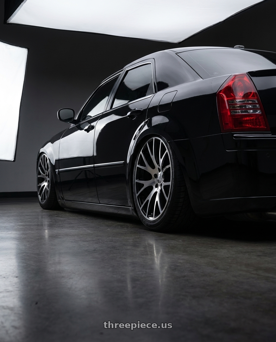 2007 Chrysler 300c srt8 black with Strada OE Replica Hellcat 5x115 22x9 +18 Gloss Black Machined wheels rear three quarter view meaty tires