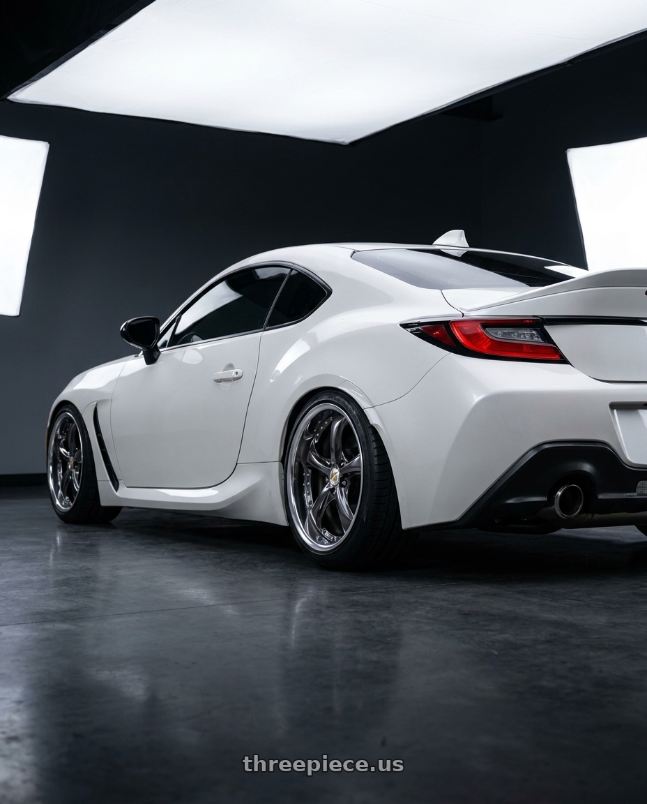 2025 Toyota gr86 base white with Work Wheels VS-KF 5x100 18x9.5+35 Brilliant Silver Black L Disk FULL REVERSE wheels rear three quarter view slight stretch tires