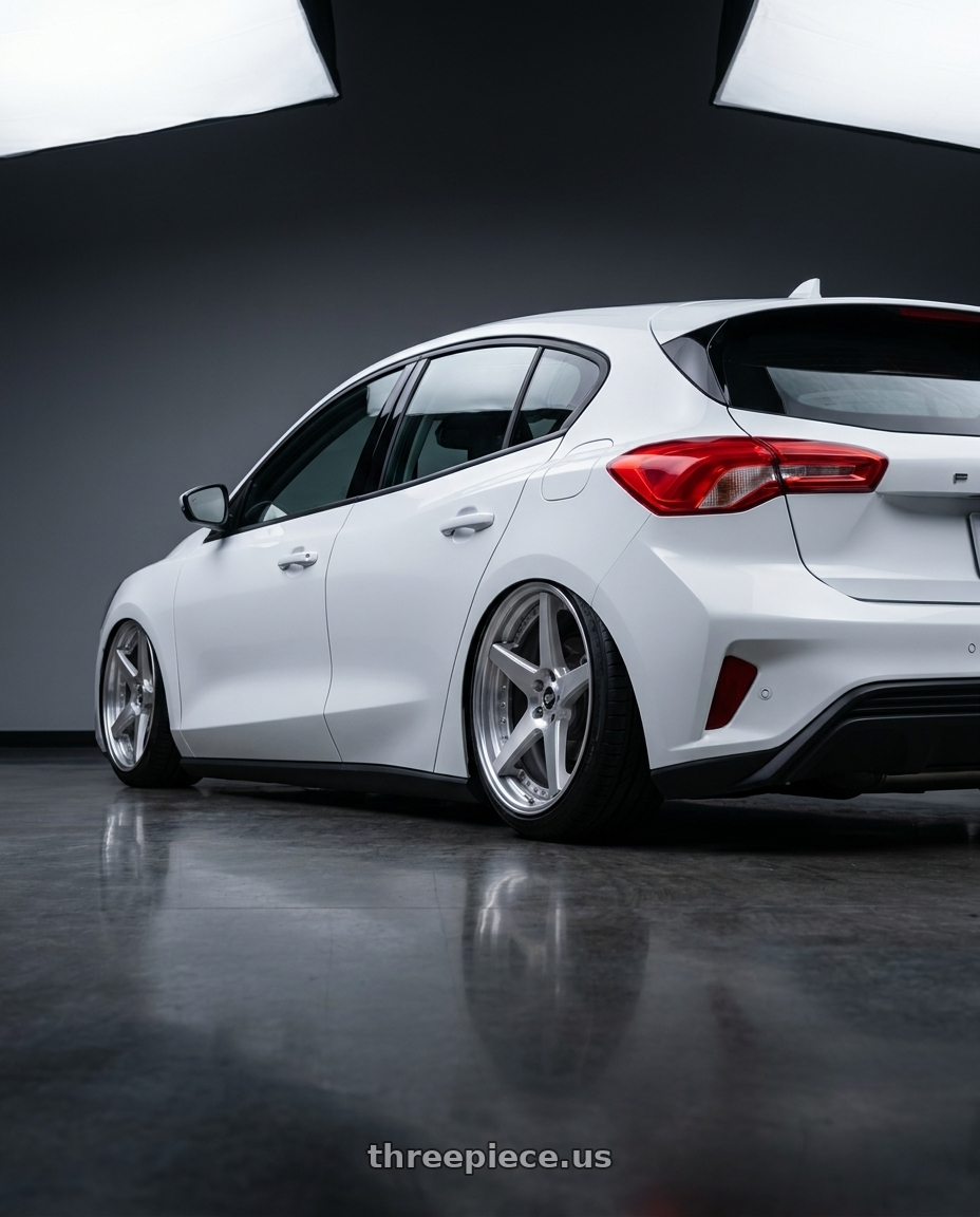 2021 Ford focus trend with Work Zeast St1 5x100 18x7.5+45 R Disk Brush Silver Clear wheels rear three quarter view slight stretch tires